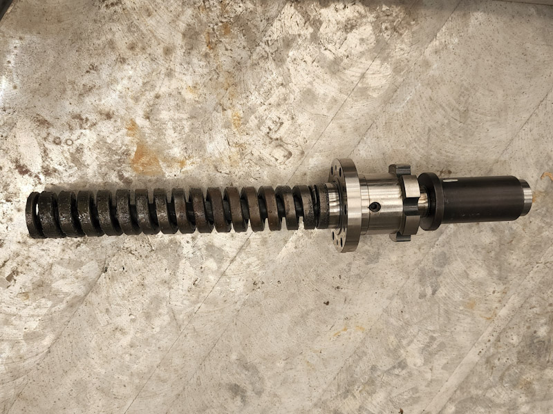 Tool clamp shaft and spring